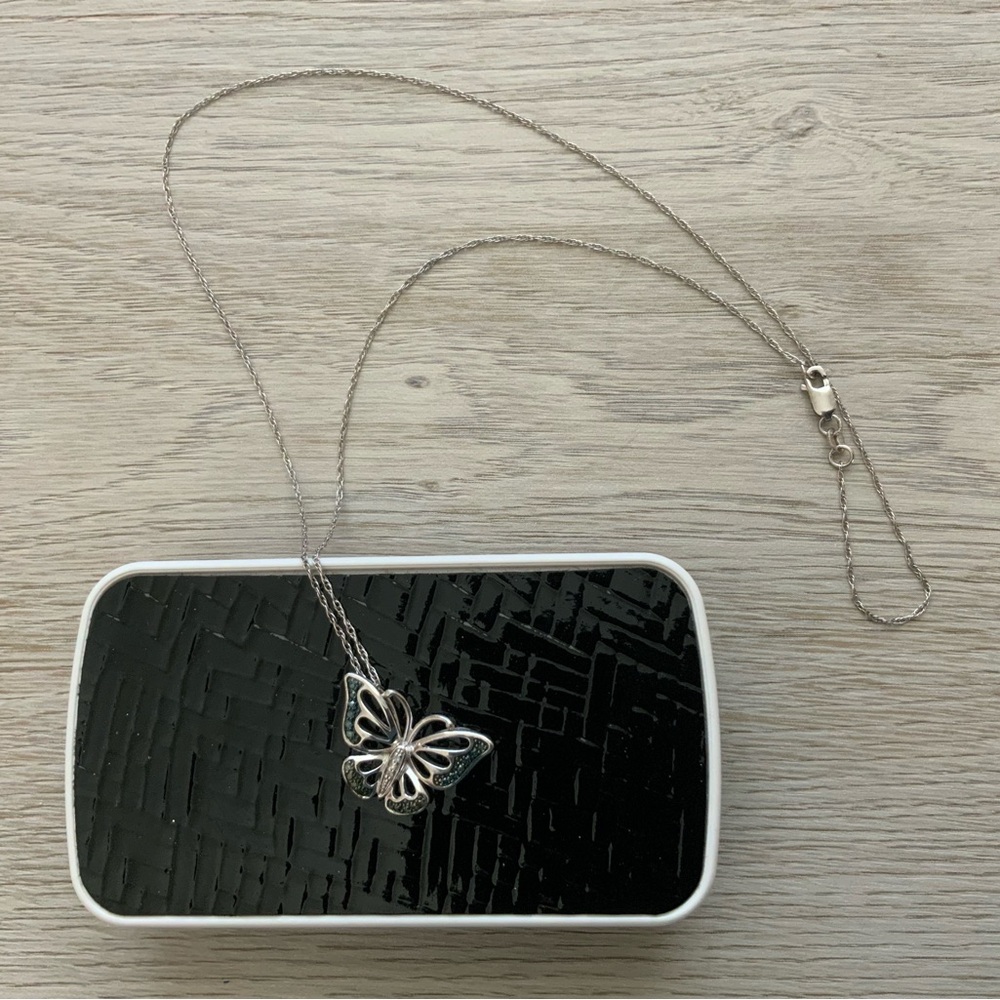 Sterling silver butterfly pendant with sapphires and diamonds.